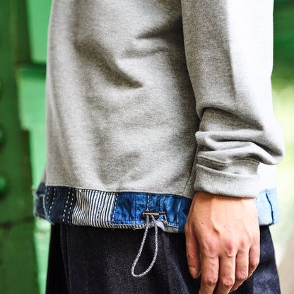 Distressed Denim Trimmed Hem Sweatshirt