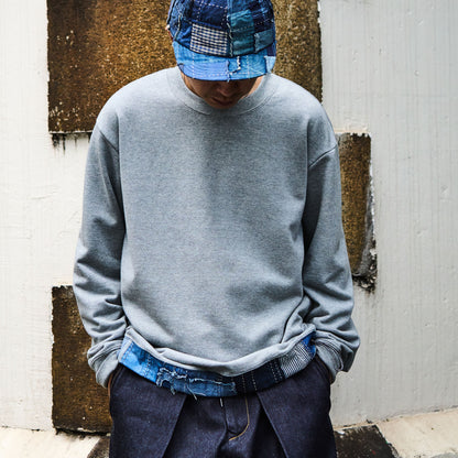 Distressed Denim Trimmed Hem Sweatshirt